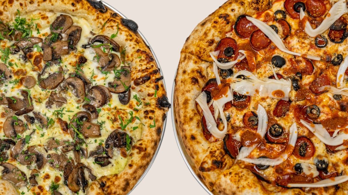 Two sourdough pizzas side by side — wild mushroom with herbs, and pepperoni with black olives and onion